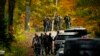 Law enforcement continue a manhunt in the aftermath of a mass shooting, in Durham, Maine, Oct. 27, 2023.