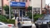 Kosovar police officers guard an office of the Postal Savings Bank from Serbia, in Mitrovica, May 20, 2024. Serbian Dinars were banned and the euro was imposed as the only legal currency, making it difficult for Kosovo Serbs to receive salaries or aid from the Serbian state. 
