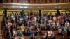 Spain's Prime Minister Pedro Sanchez, foreground left, applauds after the approval to an amnesty law at the Spanish parliament's lower house in Madrid, May 30, 2024. 