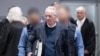 Prince Heinrich XIII Reuss arrives in the courtroom for the trial against him, a former MP and ex-army officers accused of masterminding a conspiracy theory-driven plot to attack the German parliament, May 21, 2024 in Frankfurt am Main, Germany. 
