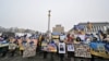 FILE - Relatives of Ukrainian prisoners said to have been captured by Russian forces hold posters showing their portraits during a at Independence Square in Kyiv on Jan. 14, 2023, as they call to hasten their release from alleged Russian captivity.