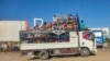 Displaced people fleeing from Wad Madani in Sudan's Jazira state arrive in Gedaref in the country's east, Dec. 19, 2023. 
