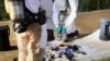 This handout photo released on June 2, 2024 shows South Korean military officers check unidentified objects believed to be North Korean trash from balloons that crossed the inter-Korea border, on a street in Seoul.