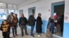 Voters queue outside a polling station during the 2023 local elections in the locality of Mnihla in Ariana province on the outskirts of Tunis on Dec. 24, 2023.