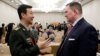Chinese Defense Ministry spokesperson Wu Qian and Chad Sbragia, former Deputy Assistant Secretary of Defense for China at the Pentagon, chat at the Beijing Xiangshan Forum in Beijing, Oct. 30, 2023. 