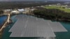 FILE - An array of solar panels float on top of a water storage pond in Sayreville, N.J., Monday, April 10, 2023. (AP Photo/Seth Wenig)