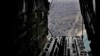 FILE - Containers of humanitarian aid are ready to be dropped from a U.S. C-17 Air Force plane to Palestinians in the Gaza Strip, March 29, 2024. 
