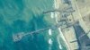 FILE - The image provided by U.S. Central Command, shows U.S. Army soldiers, U.S. Navy sailors and Israel Defense Forces placing the Trident Pier on the coast of the Gaza Strip, on May 16, 2024.