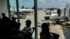 Abiria wakiwa uwanja wa ndege wa kimataifa wa Hartsfield-Jackson, Atlanta, Juni 21, 2024. Picha na Charly TRIBALLEAU / AFP.