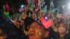 Supporters of Ko Wen-je, presidential candidate from the Taiwan People's Party (TPP), wave flags during a campaign rally in Kaohsiung, Jan. 7, 2024.
