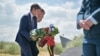 French Prime Minister Gabriel Attal (L), Britain's Prince William (C) and Canadian Prime Minister Justin Trudeau (R) lay a wreath during the 80th anniversary of the World War II "D-Day" Allied landings in Normandy, at the Juno Beach Centre in northwestern France, June 6, 2024. 