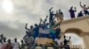 FILE - Supporters of Niger's ruling junta gather at the start of a protest called to fight for the country's freedom and push back against foreign interference in Niamey, Niger, Aug. 3, 2023.