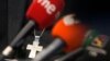 FILE - A crucifix is seen at a Feb. 22, 2022, press conference in Madrid, Spain, about sexual abuse and the Catholic Church. A report released Oct. 25, 2023, says as many as 400,000 victims may have endured sexual abuse from Spain’s clergy and lay people.
