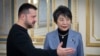 In this photo provided by the Ukrainian Presidential Press Office, Ukrainian President Volodymyr Zelenskyy, left, greets Japan's Foreign Minister Yoko Kamikawa in Kyiv, Ukraine, Jan. 7, 2024. 