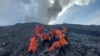 In this undated photo released Dec. 5, 2023, by the Indonesian National Search and Rescue Agency (BASARNAS), rescuers prepare to evacuate the body of a climber killed in Mount Marapi's eruption in Agam, West Sumatra, Indonesia. 