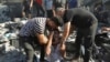 Palestinians comfort a crying man after he lost relatives under the rubble of a destroyed house following an Israeli airstrike in Gaza City, Nov. 4, 2023. 