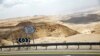 FILE - A road sign pointing to the direction of the southern Israeli city of Eilat is seen north to Eilat, Israel, June 12, 2018. 