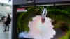 A TV screen shows a file image of North Korea's missile launch during a news program at the Seoul Railway Station in Seoul, South Korea, July 25, 2023.