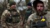Ukrainian servicemen take a break on the frontline near the town of Bakhmut, Donetsk region, on Nov. 18, 2023, amid the Russian invasion of Ukraine.