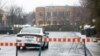FILE - A police car patrols in a Jewish community in Montreal, Canada, March 30, 2020. A Jewish school in the city was reportedly hit by gunfire Sunday.