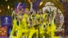 Australian players celebrate with the trophy after winning against India during the ICC Men's Cricket World Cup final match in Ahmedabad, India, Nov.19, 2023.