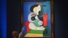 Sotheby's employees take phone bids during the 'The Emily Fisher Landau Collection: An Era Defined' auction for Pablo Picasso's 'Femme a la Montre' at Sotheby's in New York City on Nov. 8, 2023. 