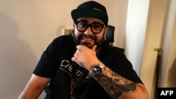 Sean, the owner of a tattoo studio in Iran's capital Tehran, poses for a picture during an interview with AFP on Nov. 7 2023. 