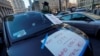 FILE - Drivers with the ride-sharing company Uber take part in a protest against a lawsuit which aims to block pay raises ordered by New York City Taxi and Limousine Commission in New York City, Dec. 19, 2022.