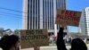 FILE - Pro-Palestinian demonstrators chant slogans outside the Israeli Consulate in Atlanta, Oct. 8, 2023. A protester with a Palestinian flag self-immolated outside the building on Dec. 1, 2023, authorities said. 