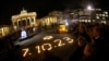 FILE - People commemorate the victims of the October 7 Hamas attack on Israel, in front of Brandenburg gate, in Berlin, Germany, Nov. 7, 2023. Several nations, including Germany and the U.S., have established a task force to counter the flow of money to Hamas.