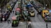 Tractors and trucks stand in a street during a protest of farmers and truck drivers, Jan. 15, 2024 in Berlin, Germany. 