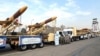 A handout photo provided by the Iranian Army media office Dec. 10, 2023, shows Iranian Karrar drones during their unveiling in Tehran.