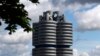 FILE - Clouds hang over the headquarters of German carmaker BMW, in Munich, Germany, May 14, 2021.