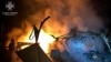 This handout picture by Ukrainian Emergency Service shows a firefighter pushing out a fire in destroyed private house following Russian strike in Kupiansk, Nov. 9, 2023. (Photo by Handout / Ukraine Emergency Service / AFP) 