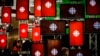 FILE - A man sits inside the Canadian Broadcasting Corp. broadcast center in Toronto, May 23, 2014.