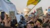 Iraqis raise copies of the Quran, Muslims' holy book, during a protest in Tahrir Square, July 20, 2023 in Baghdad, Iraq. 