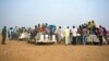 FILE - Nigeriens and third-country migrants head toward Libya from Agadez, Niger, June 4, 2018. Niger's junta has revoked a 2015 anti-migration law that had helped reduce the flow of West Africans to Europe.