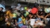 Palestinians crowded together as they wait for food distribution in Rafah, southern Gaza Strip, Nov. 8, 2023. 