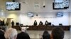 Officials listen as presiding judge Brigida Cavasino, center, reads the verdicts of a maxi-trial of hundreds of people accused of membership in Italy's 'Ndrangheta organized crime syndicate, in Lamezia Terme, southern Italy, Nov. 20, 2023. 