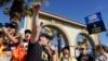 SAG-AFTRA chief negotiator Duncan Crabtree-Ireland, left, rallies striking actors in outside Paramount Pictures studio, Nov. 3, 2023, in Los Angeles. 