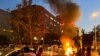 FILE- A police motorcycle burns during a protest over the death of Mahsa Amini, in Tehran, Iran September 19, 2022. 