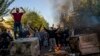 FILE - In this photo taken by someone not employed by The Associated Press, Iranians protest the death of Mahsa Amini in Tehran on Oct. 27, 2022. A human rights group reported Nov. 24, 2023, that Iran had executed and buried a man in connection with the protests.