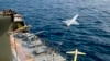FILE - In this photo released by the Iranian Army on Aug. 25, 2022, a drone is launched from a warship in a military drone drill in Iran. 