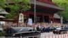 FILE - The vehicle carrying the body of former Japanese Prime Minister Shinzo Abe leaves Zojoji temple after his funeral in Tokyo on July 12, 2022.