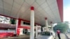 FILE - An attendant pumps fuel into a taxi at a gas station in Botahtaung township in Yangon, Myanmar, on Nov. 12, 2021. 