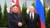 FILE - This picture released April 26, 2019, by North Korea's official Korean Central News Agency (KCNA) shows Russian President Vladimir Putin (R) and North Korean leader Kim Jong Un shaking hands a day earlier prior to their talks on Russky island in th