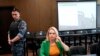 FILE - Marina Ovsyannikova, a former Russian state TV journalist who quit after making an on-air protest of Russia's military operation in Ukraine, sits in a court room prior to a hearing in Moscow, July 28, 2022.
