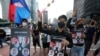 FILE - Myanmar nationals living in South Korea march to condemn Myanmar's recent executions of activists, at the down town in Seoul, South Korea, Saturday, July 30, 2022.