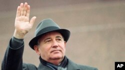 FILE - Soviet President Mikhail Gorbachev waves from the Red Square tribune during a Revolution Day celebration, in Moscow, Soviet Union, Nov. 7, 1989.