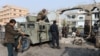 Afghan security forces inspect the site of an attack by Islamic State militants at the British charity Save the Children compound in Jalalabad on Jan. 25, 2018.